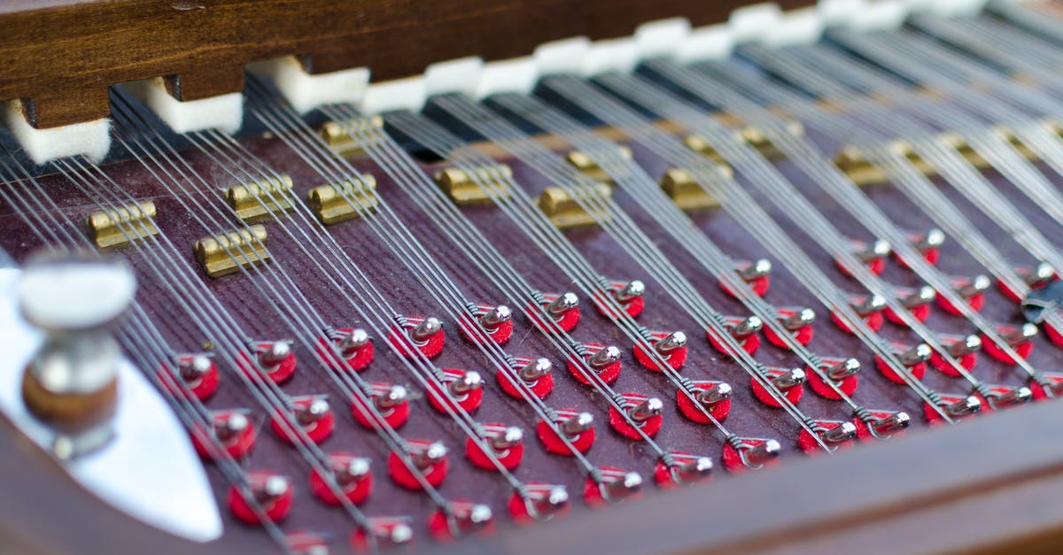 Don't touch anything - what does the top left panel do? - Closeup Photography of Instrument Strings