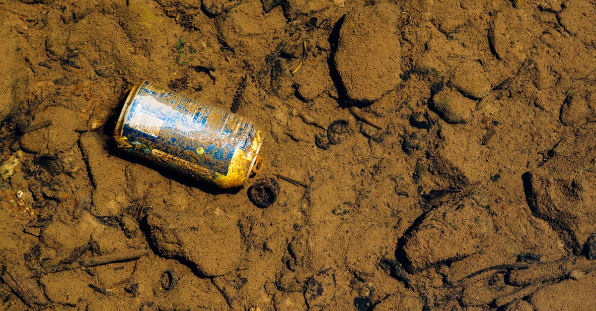Dupes are not sweeping polluted dirt - Blue Labeled Can on Sand