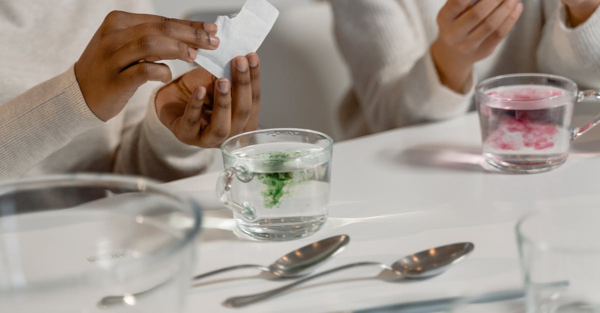 Dwarf Fortress starter pack - start DFHack - A Person Holding White Pack Near a Mug of Water Dwarf Fortress starter pack - start DFHack - A Person Holding White Pack Near a Mug of Water