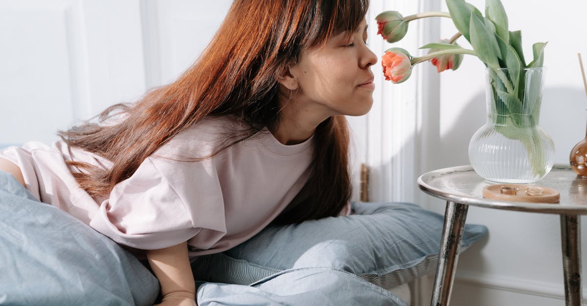 Dwarf hauls the minecart instead of push/riding it - Young dwarf woman smelling flowers in vase on table Dwarf hauls the minecart instead of push/riding it - Young dwarf woman smelling flowers in vase on table