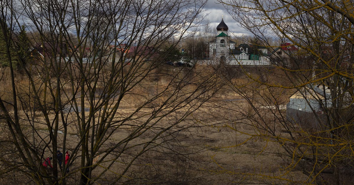 Dwellers in the wasteland always get no more than 1 item found? - White and Blue Concrete Building Near Bare Trees Under White Clouds