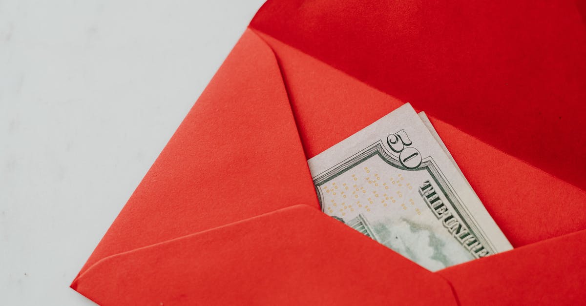 Easiest way to make cash - Red Envelope on White Table Easiest way to make cash - Red Envelope on White Table
