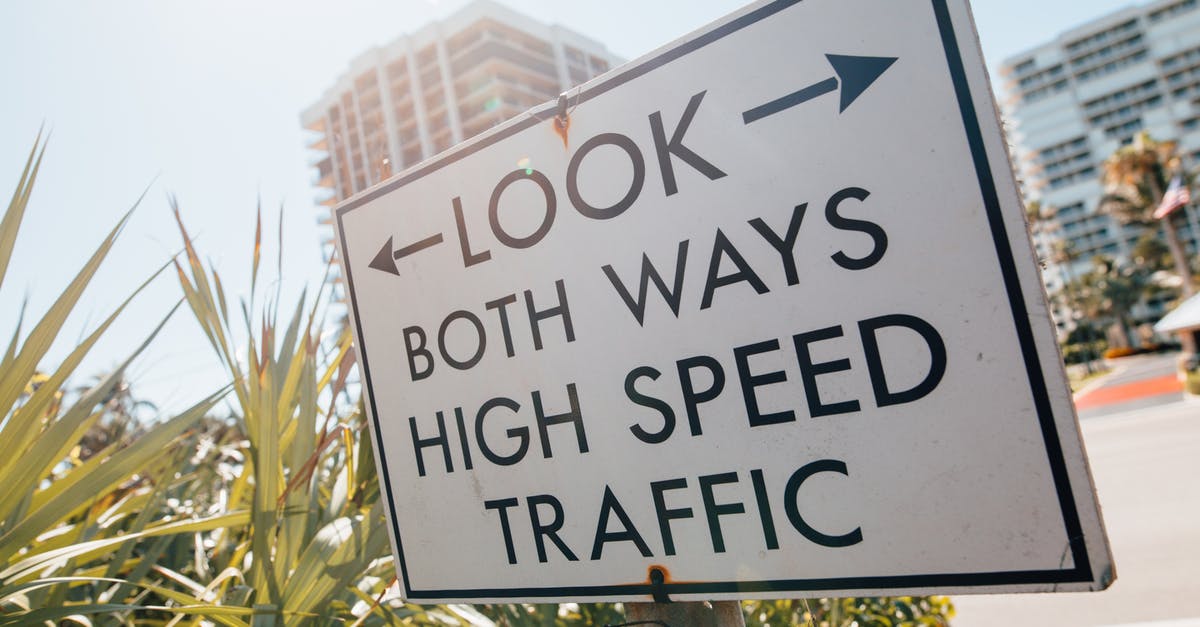 Easy way to edit object thumbnails in cities skylines? - Direction sign with arrow and look both ways high speed traffic text placed on sidewalk near tropical plants against modern city buildings Easy way to edit object thumbnails in cities skylines? - Direction sign with arrow and look both ways high speed traffic text placed on sidewalk near tropical plants against modern city buildings