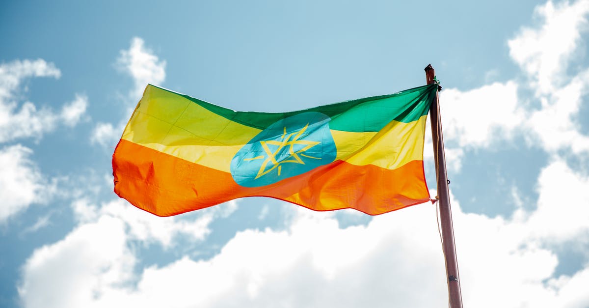 Eevee evolutions [duplicate] - National colorful flag of Ethiopia under cloudy sky