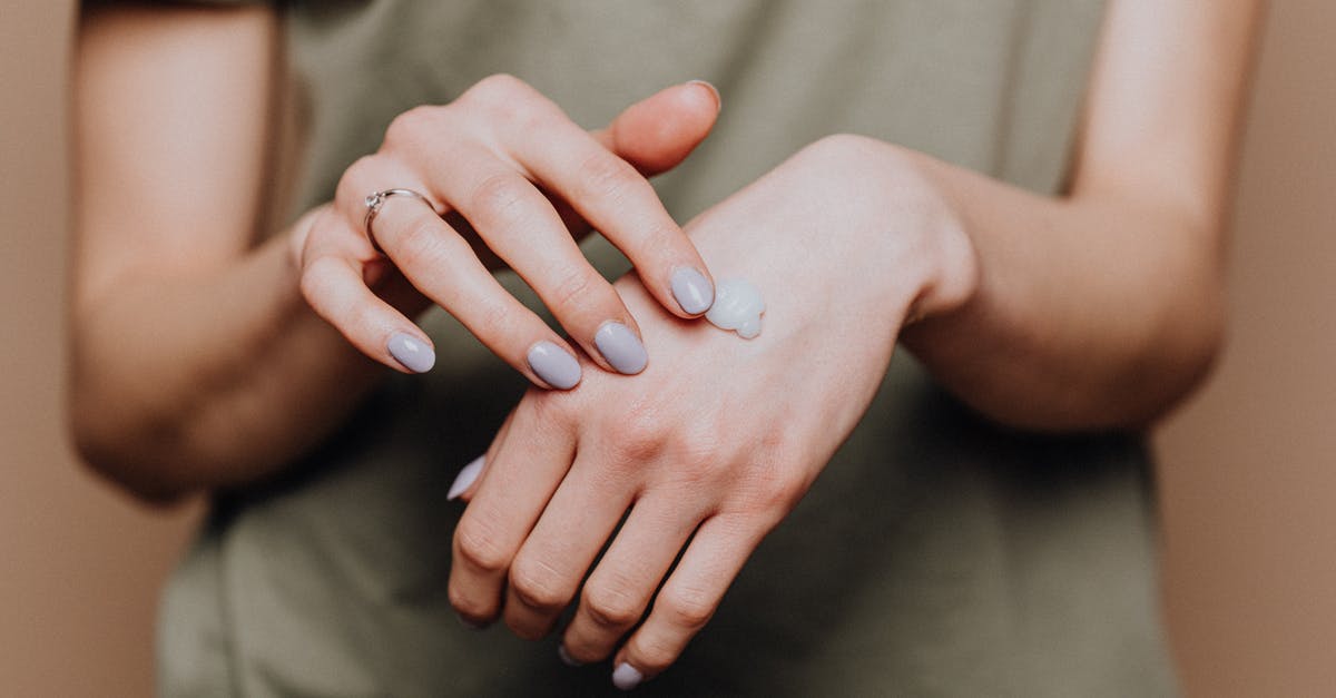 Elden Ring - How to apply the Seppuku buff on *both* weapons? - Crop anonymous female in casual shirt with manicured hands and ring softly rubbing hand moisturizer in back of hand skin