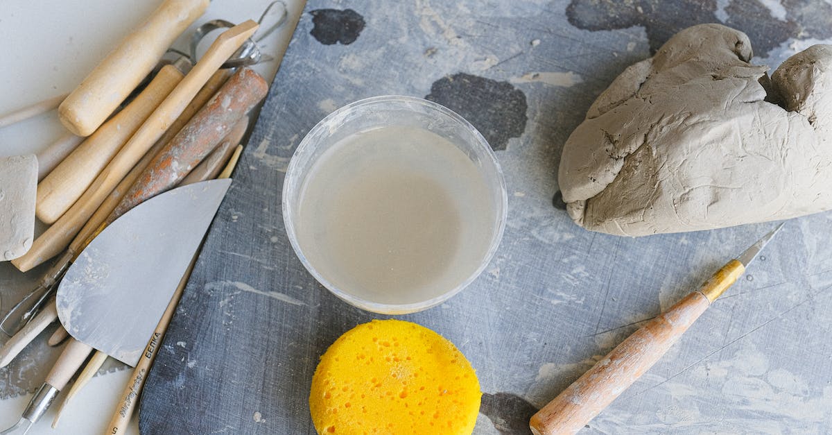 Elemental Skill Damage on items - Tools and bowl of water prepared for clay modeling Elemental Skill Damage on items - Tools and bowl of water prepared for clay modeling