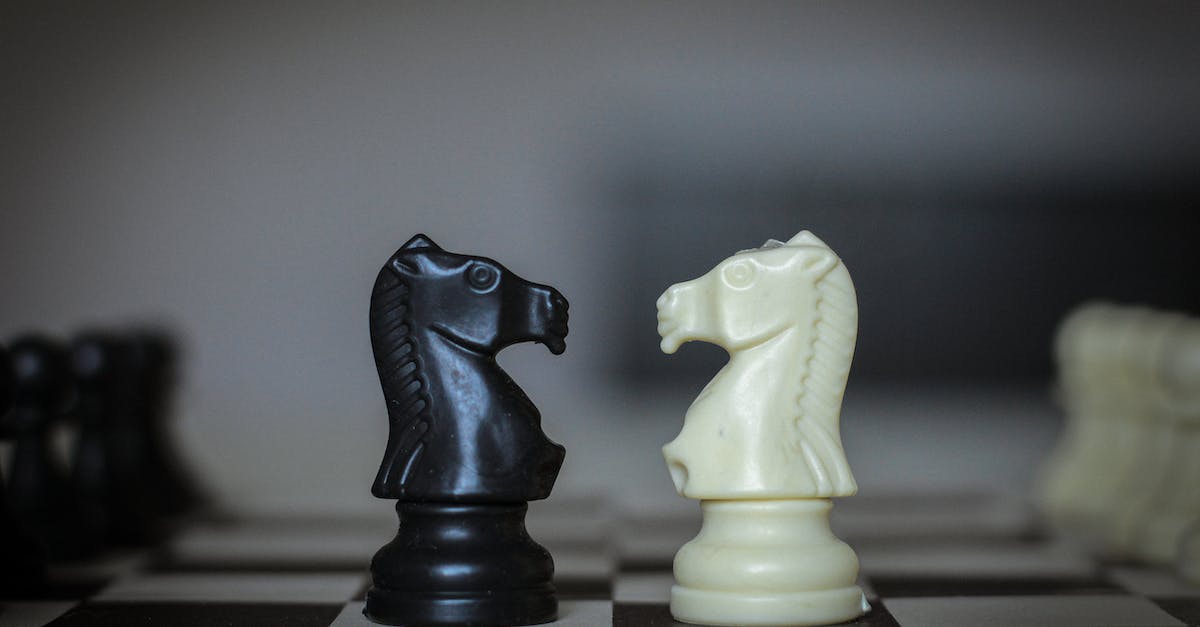 Elite Knight set vs Faraam Knight set - Chess pieces placed on chessboard square