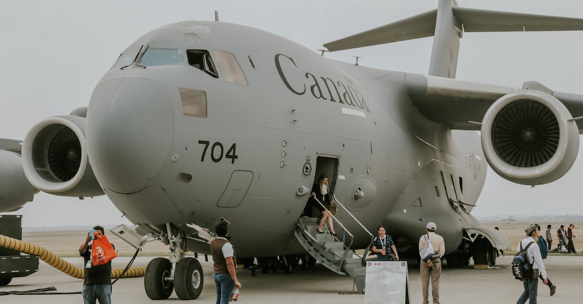 Embarking and disembarking - People Disembarking C-17 Transport Airplane