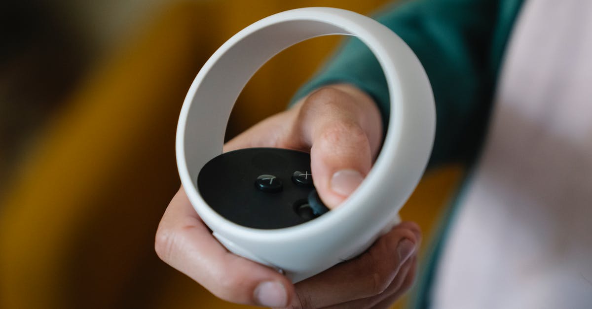 Enable "Play" button for Undertale on Linux Steam - High angle of crop anonymous male gamer using VR controller for playing video game at spare time