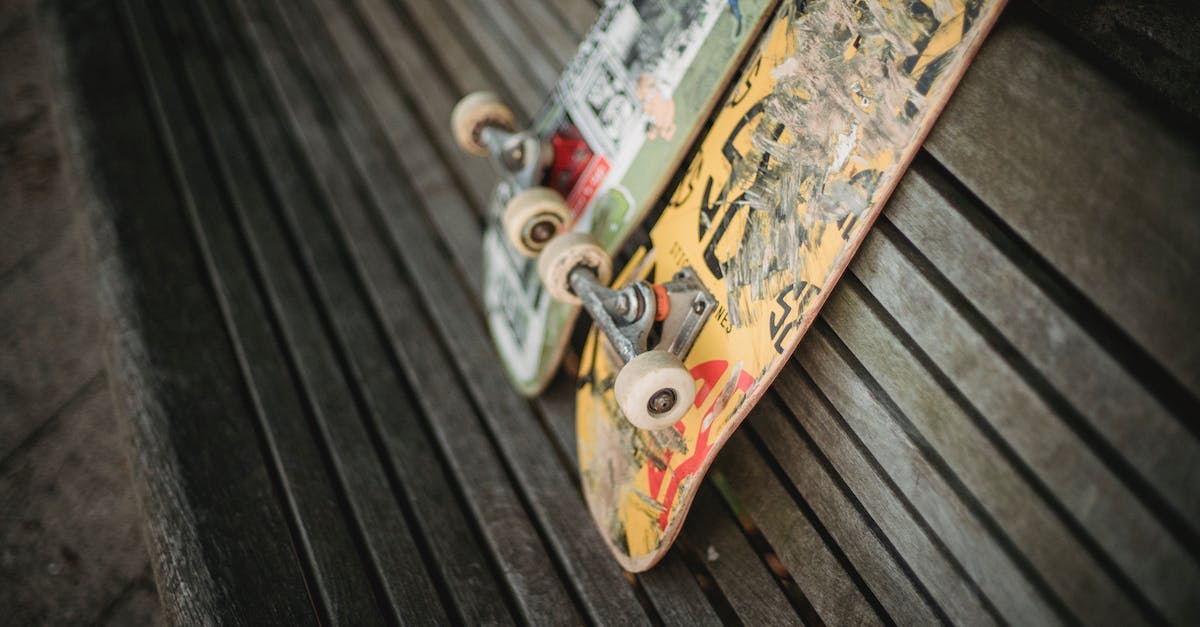 Enchant Property: Damage vs. Attack Speed % - Shabby skateboards on wooden bench in park