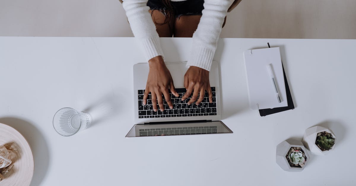 End of Input Error in Tellraw - Woman in White Long Sleeve Shirt Using Macbook Pro