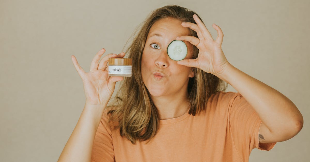 Enderman Containment - Woman in Orange Crew Neck T-shirt Holding White and Black Card