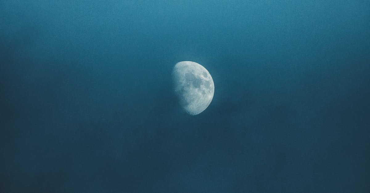 endless legend no watchtowers - Waxing white moon with gray spots illuminating on foggy sky at bright night endless legend no watchtowers - Waxing white moon with gray spots illuminating on foggy sky at bright night