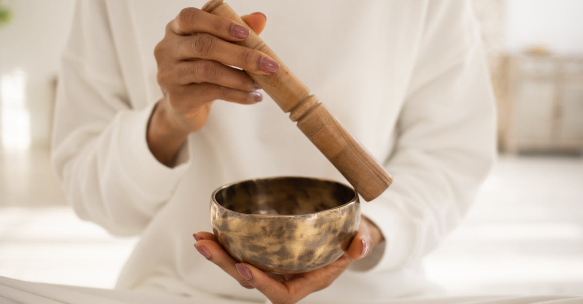 Enemy crewmembers still being healed after using an Ion Bomb on their medbay - Close-Up Shot of a Person Using a Singing Bowl Enemy crewmembers still being healed after using an Ion Bomb on their medbay - Close-Up Shot of a Person Using a Singing Bowl