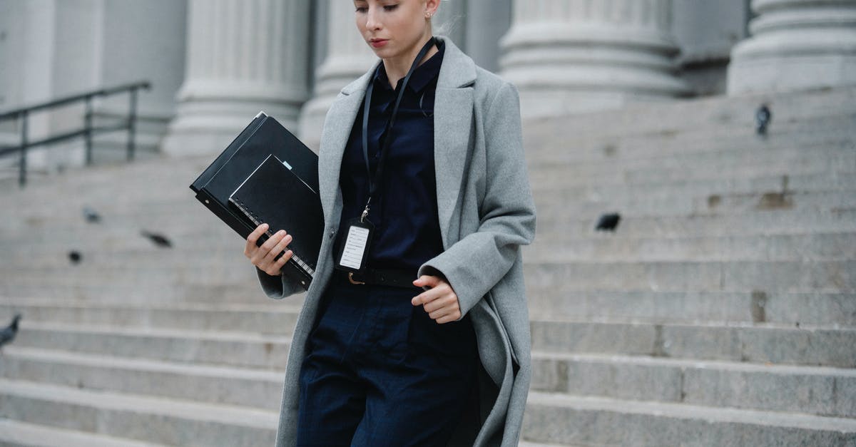 Error! App '255850' state is is 0x2 after update job - Serious businesswoman hurrying with documents from courthouse