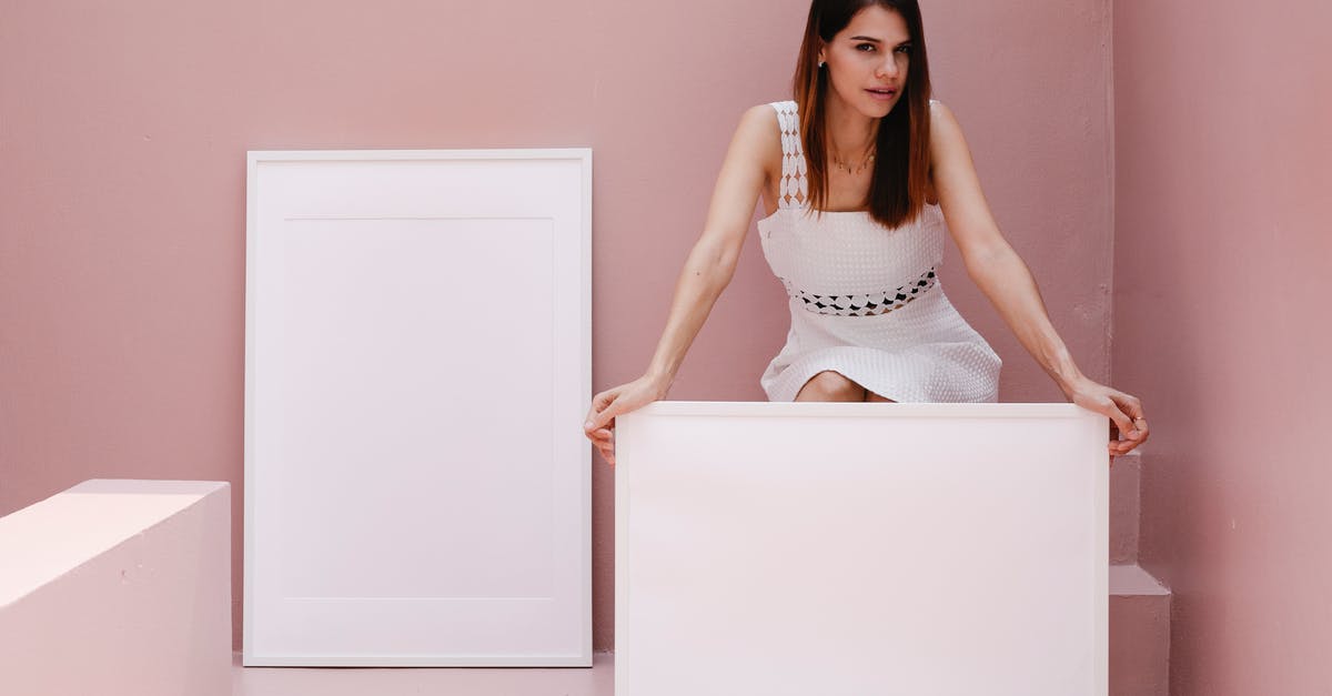 Escapists shows blank frame when launching Steam - Young woman advertising blank white frames in pink room Escapists shows blank frame when launching Steam - Young woman advertising blank white frames in pink room
