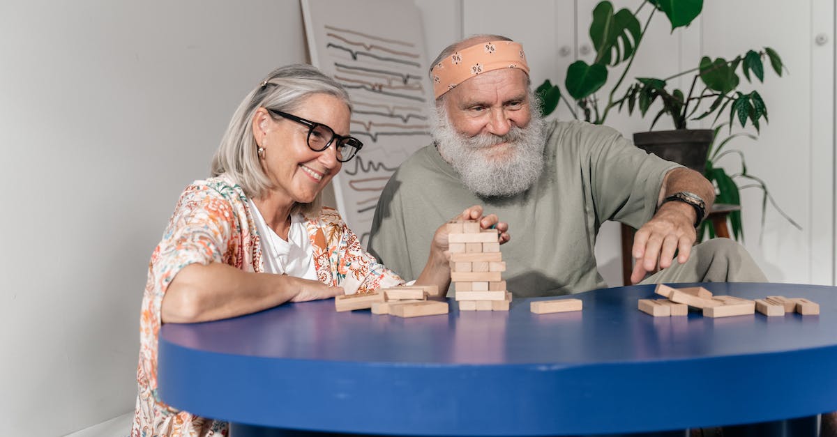 Expieriencing Block\Tick Lag - Man and Woman Playing Jenga Expieriencing Block\Tick Lag - Man and Woman Playing Jenga
