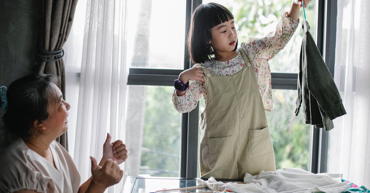 Expression2 Help Request: Rotating an entity on one axis - Happy Asian woman showing like gesture while granddaughter organizing clothes on hanger at home Expression2 Help Request: Rotating an entity on one axis - Happy Asian woman showing like gesture while granddaughter organizing clothes on hanger at home