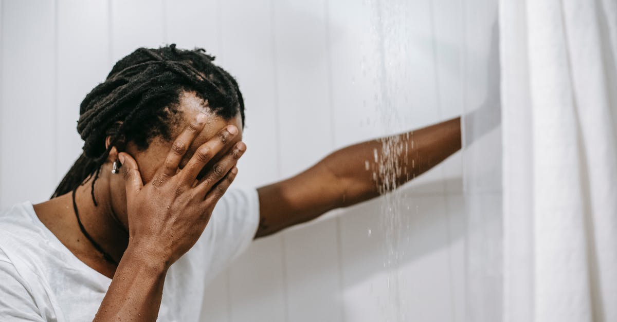 Fallout 3 Trouble on the Homefront trophy isn't unlocking - Sad African American man covering face with hand in shower cabin Fallout 3 Trouble on the Homefront trophy isn't unlocking - Sad African American man covering face with hand in shower cabin