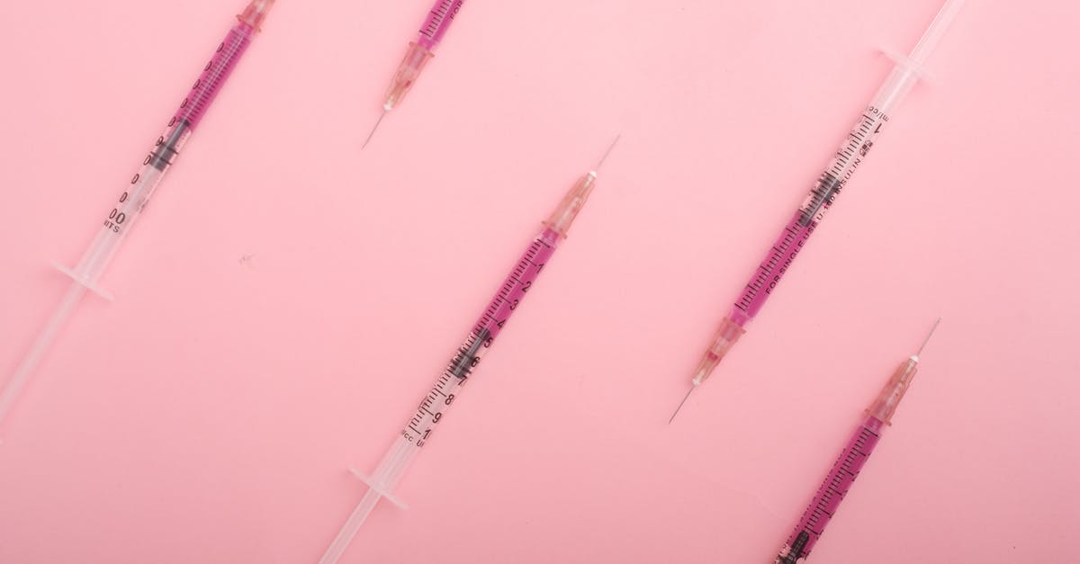 Fallout New Vegas, hardcore mode. A doctor refuses to heal non-crippled damaged limb of the Courier in full hp - Top view set of syringes with purple colored liquid medicine arranged on pink background as background