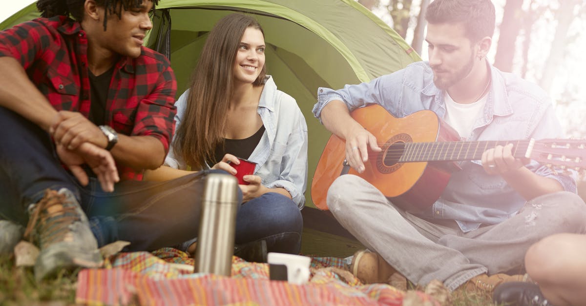 Fallout Shelter Dweller Happiness [duplicate] - A Photo of a Man Strumming on Acoustic Guitar