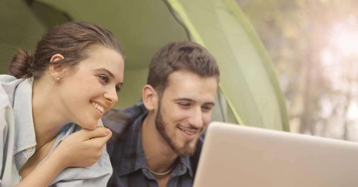 Fallout Shelter Dweller Happiness [duplicate] - Woman in Denim Long Sleeves Beside Man Using Laptop