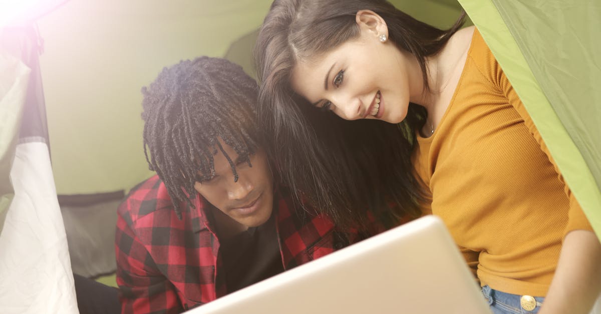 Fallout Shelter Kids in 3 Hours? [duplicate] - A Photo of a Couple Inside Fabric Shelter Using Computer Laptop