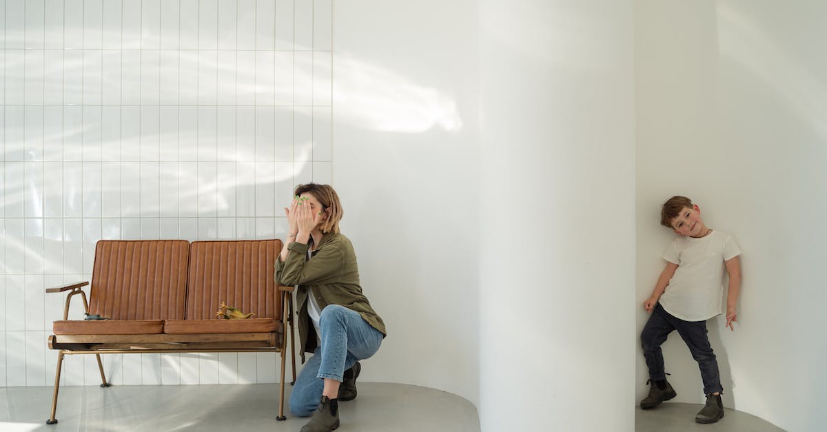 Family dweller? [duplicate] - Woman in Gray T-shirt and Blue Denim Jeans Sitting on White Chair