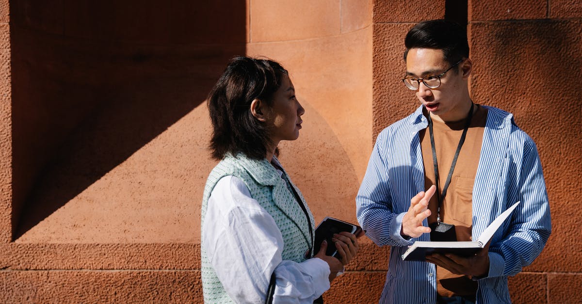 Farkas keeps talking to me - Woman in White Long Sleeve Shirt Sitting on Chair