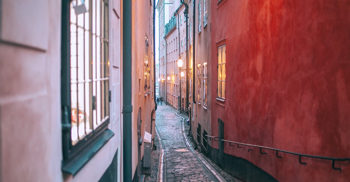 Fastest way to clear cobblestone blocks - Narrow cobblestone pedestrian passage between old apartment buildings with burning electric lights in windows at twilight Fastest way to clear cobblestone blocks - Narrow cobblestone pedestrian passage between old apartment buildings with burning electric lights in windows at twilight