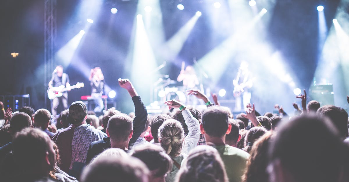 Festival of Time Secrets - Crowd in Front of People Playing Musical Instrument during Nighttime