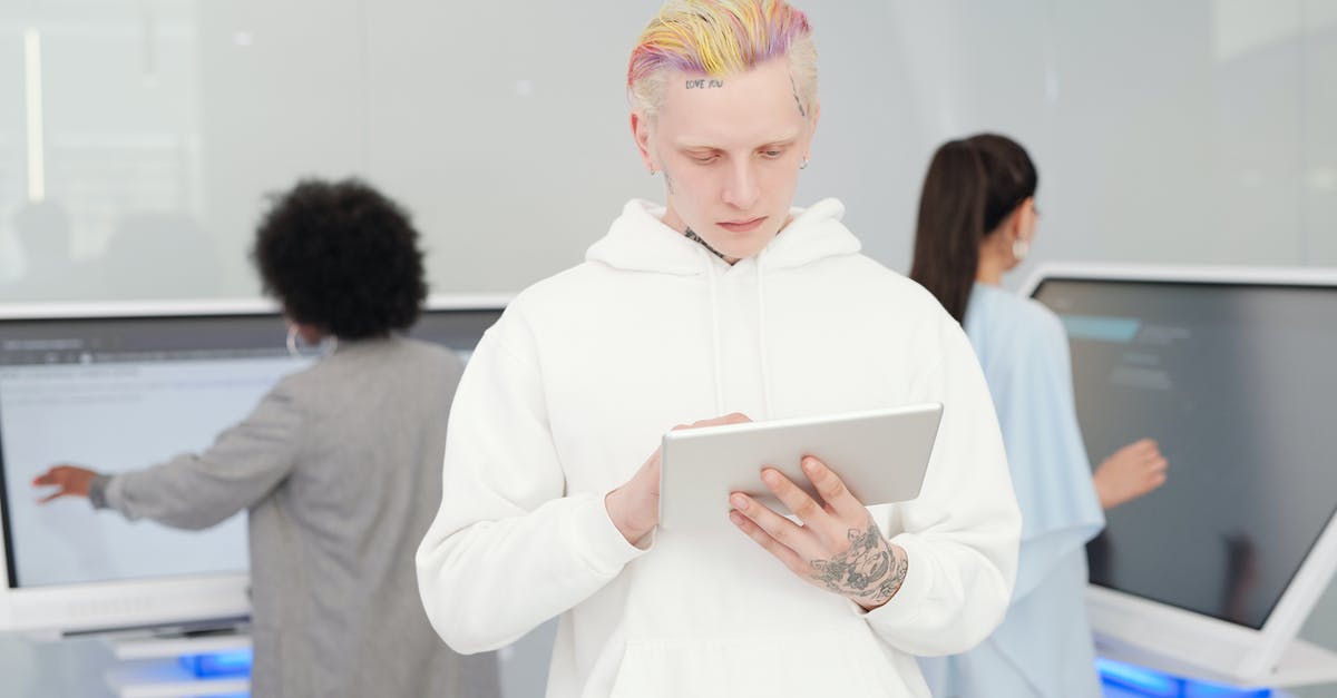 Fifa 16 stops working while checking connection - Woman in White Long Sleeve Shirt Holding White Tablet Computer Fifa 16 stops working while checking connection - Woman in White Long Sleeve Shirt Holding White Tablet Computer