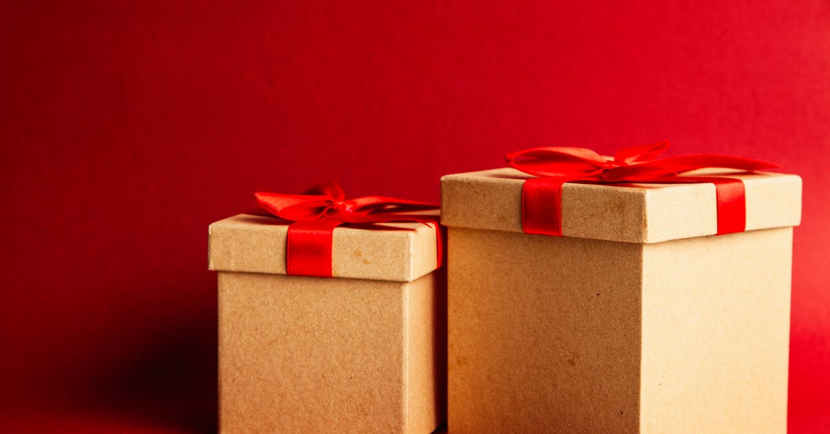 Fill in red boxes - Two Brown-and-red Gift Boxes on Red Surface