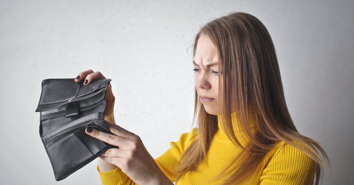 Finding better weapons? - Woman Holding Black Wallet Finding better weapons? - Woman Holding Black Wallet