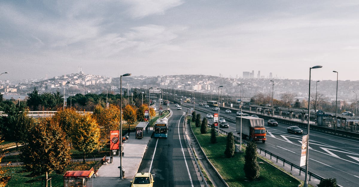 Finding multiple End cities - Multiple lane highway with driving vehicles located in Istanbul city suburb area on autumn day