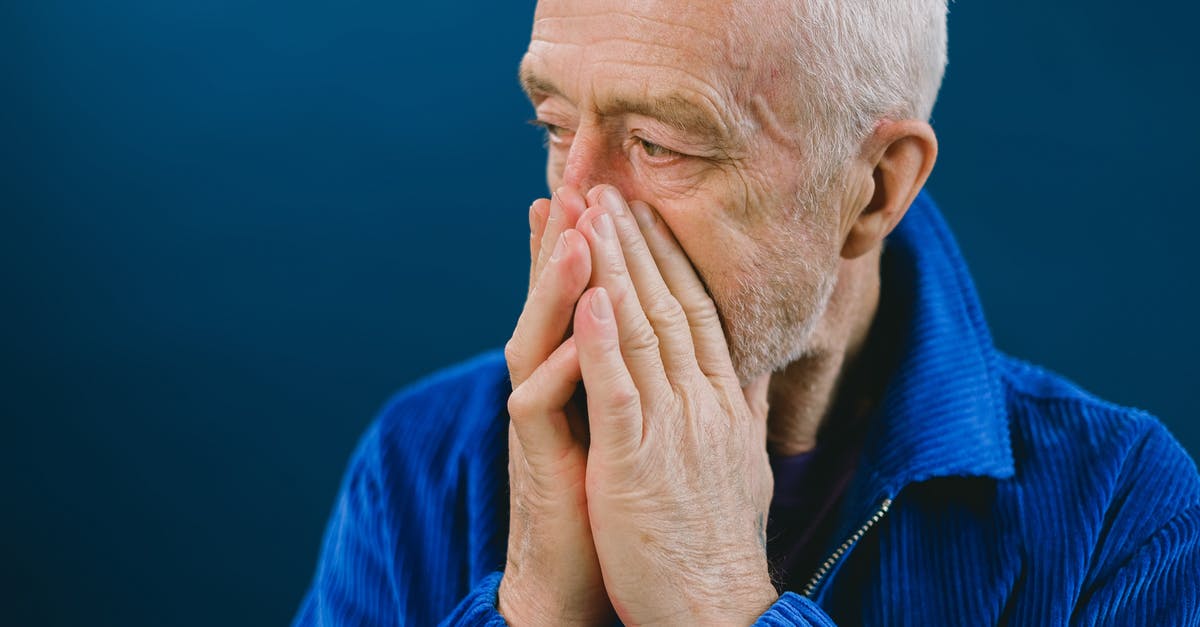 Five Nights At Freddy's Age Rating Confusion - Stressed elderly man covering mouth Five Nights At Freddy's Age Rating Confusion - Stressed elderly man covering mouth