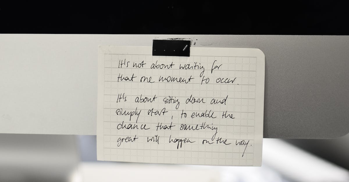 Floating text with more than one line - Written text with black words on rectangular shaped paper sheet with square ornament in daylight Floating text with more than one line - Written text with black words on rectangular shaped paper sheet with square ornament in daylight