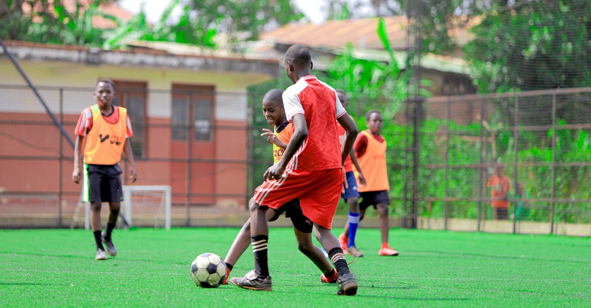 Football Manager 2020 - how to automate substitutions? - Man in Orange Jersey Shirt Playing Soccer