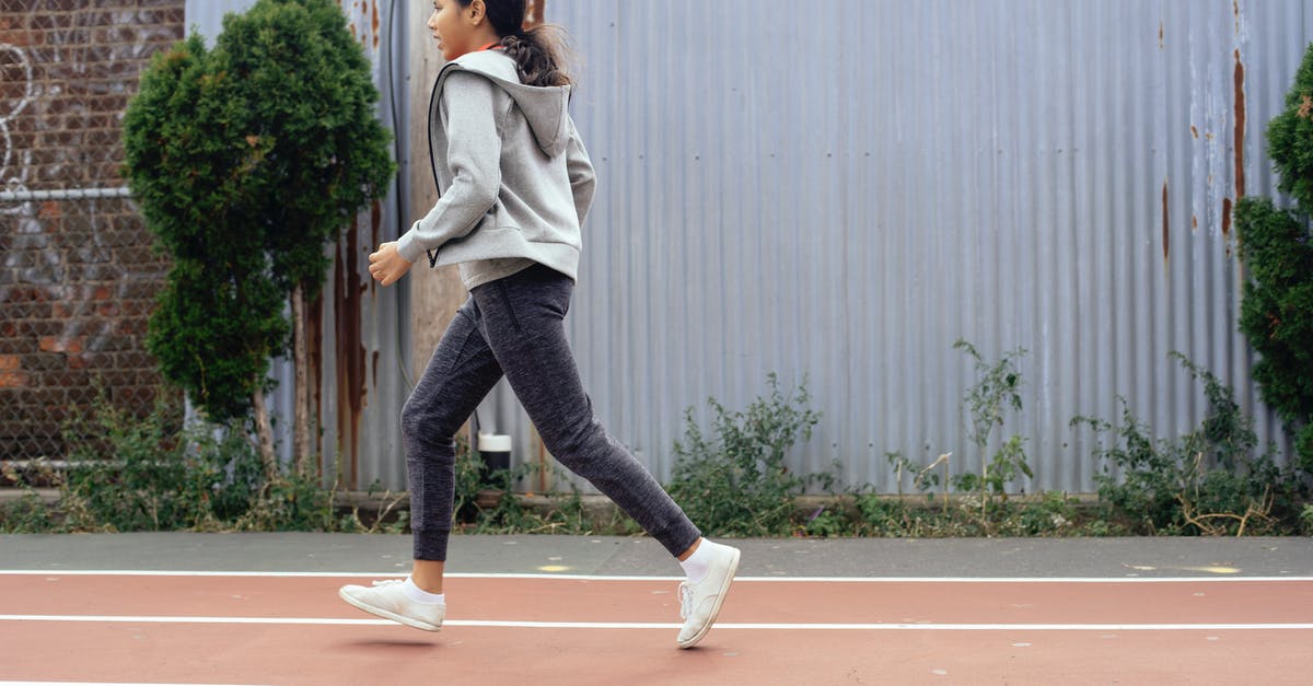 For a non-lethal run, do I need to keep bodies off the ground? - Ethnic girl running on empty stadium For a non-lethal run, do I need to keep bodies off the ground? - Ethnic girl running on empty stadium