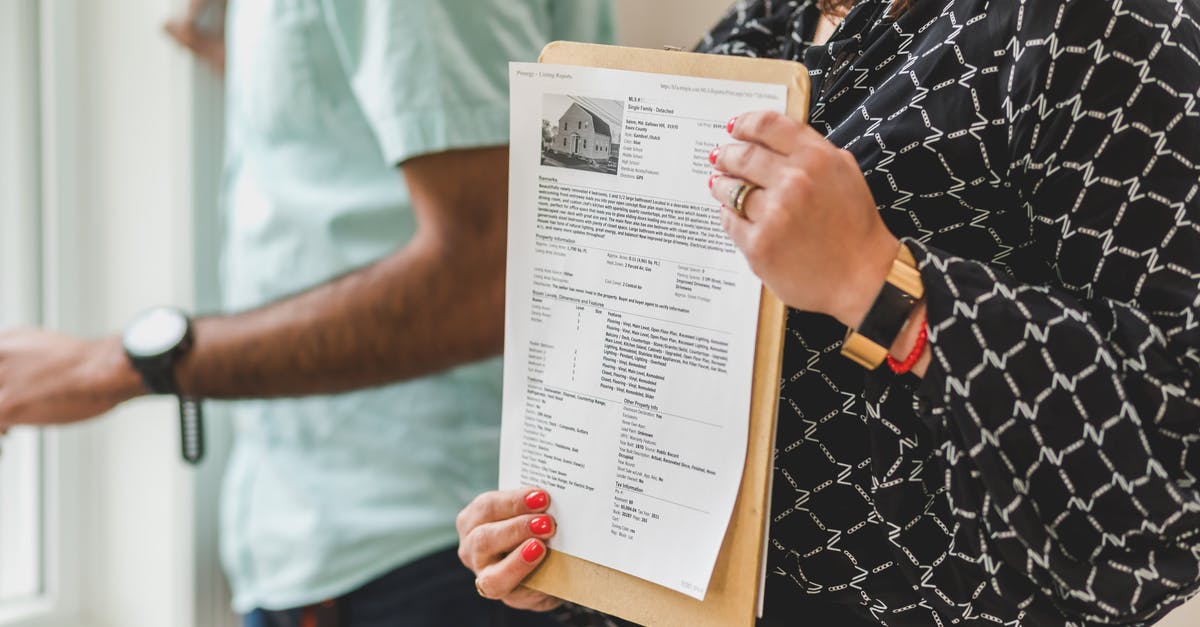 Formatting the Clan Description in Clan Info - A Person Holding a Paper with a Picture of a House Formatting the Clan Description in Clan Info - A Person Holding a Paper with a Picture of a House