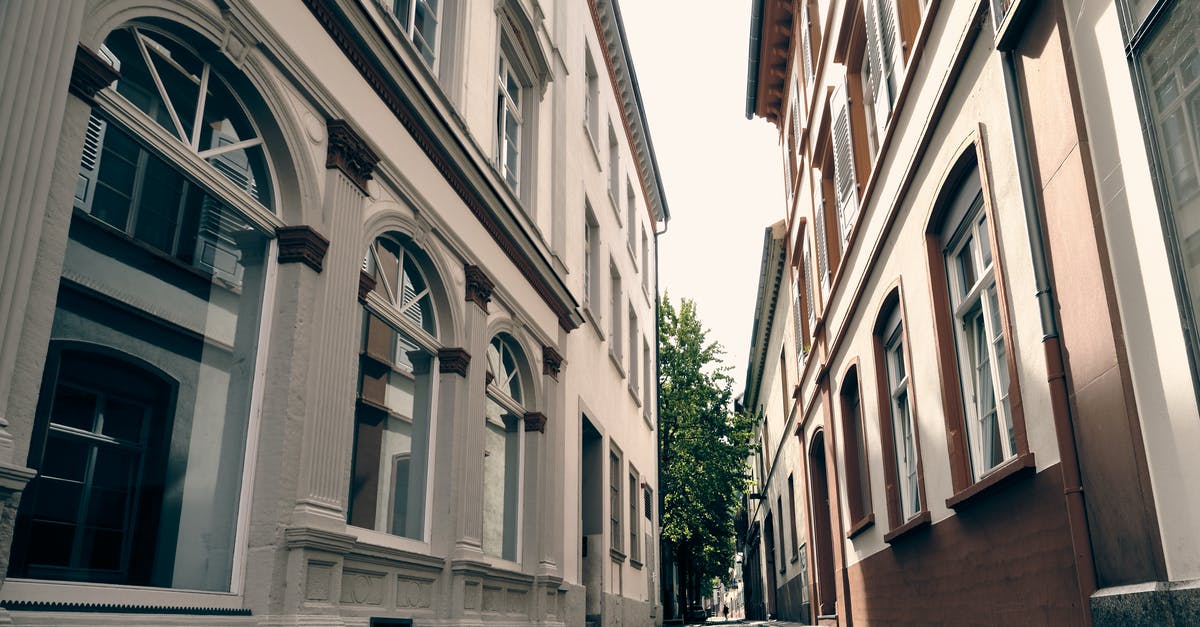 Foundation issue between buildings - Empty Street Between Concrete Buildings