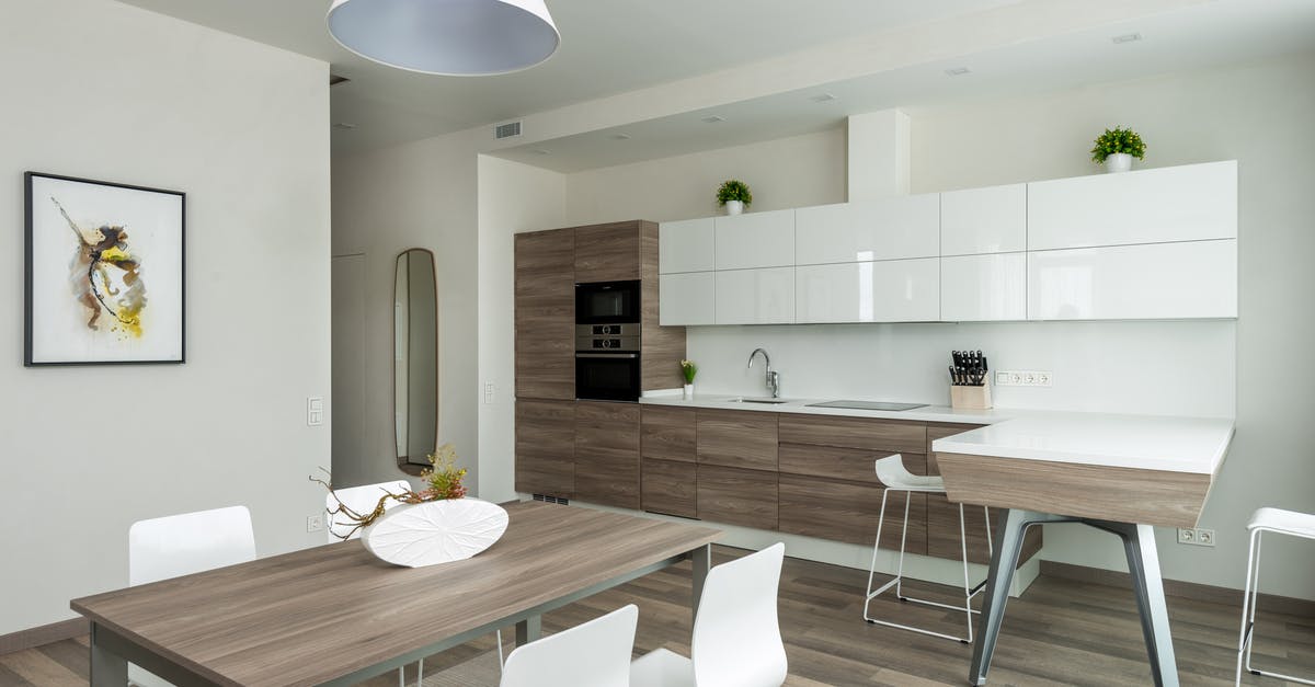 FPS counter in Steam Big Picture mode - Wooden table with chairs placed near counter and cabinets in modern spacious kitchen decorated with potted plants and framed pictures in daylight FPS counter in Steam Big Picture mode - Wooden table with chairs placed near counter and cabinets in modern spacious kitchen decorated with potted plants and framed pictures in daylight