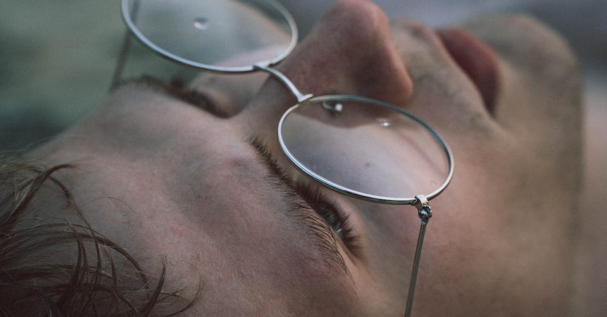Framerate drop when looking at panels? - Closeup of crop young male in eyewear with pure water drips looking up on blurred background Framerate drop when looking at panels? - Closeup of crop young male in eyewear with pure water drips looking up on blurred background