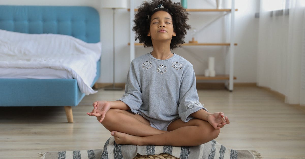 Free Spirit Ending on Chipset-0 - Black girl meditating in room with eyes closed Free Spirit Ending on Chipset-0 - Black girl meditating in room with eyes closed