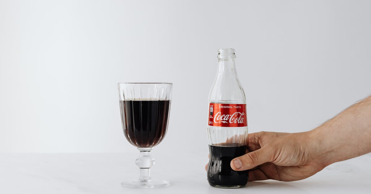 Full effects of being in the same team in Civilization V - Crop man putting bottle of cola near wineglass on table Full effects of being in the same team in Civilization V - Crop man putting bottle of cola near wineglass on table