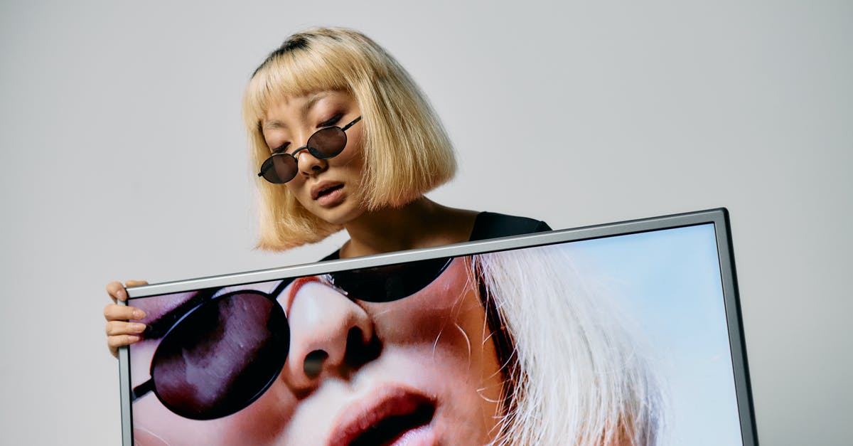 Full Screen Dual Monitor issue - Photo of Woman Holding a Monitor Full Screen Dual Monitor issue - Photo of Woman Holding a Monitor