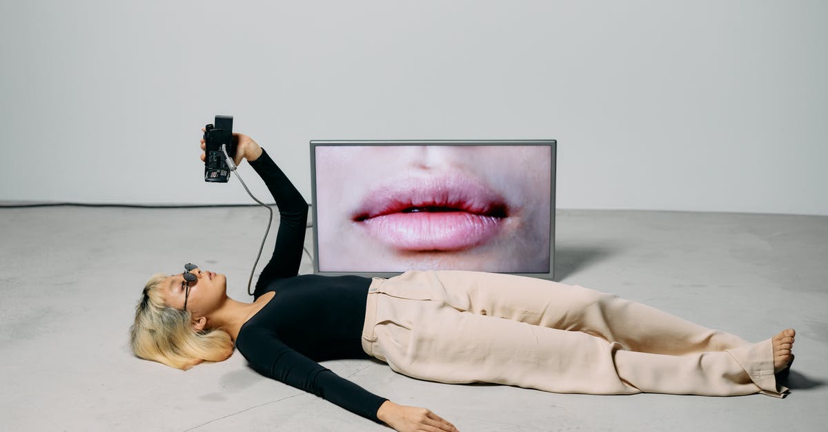 Full Screen Dual Monitor issue - Photo of Woman Laying on the Ground Full Screen Dual Monitor issue - Photo of Woman Laying on the Ground
