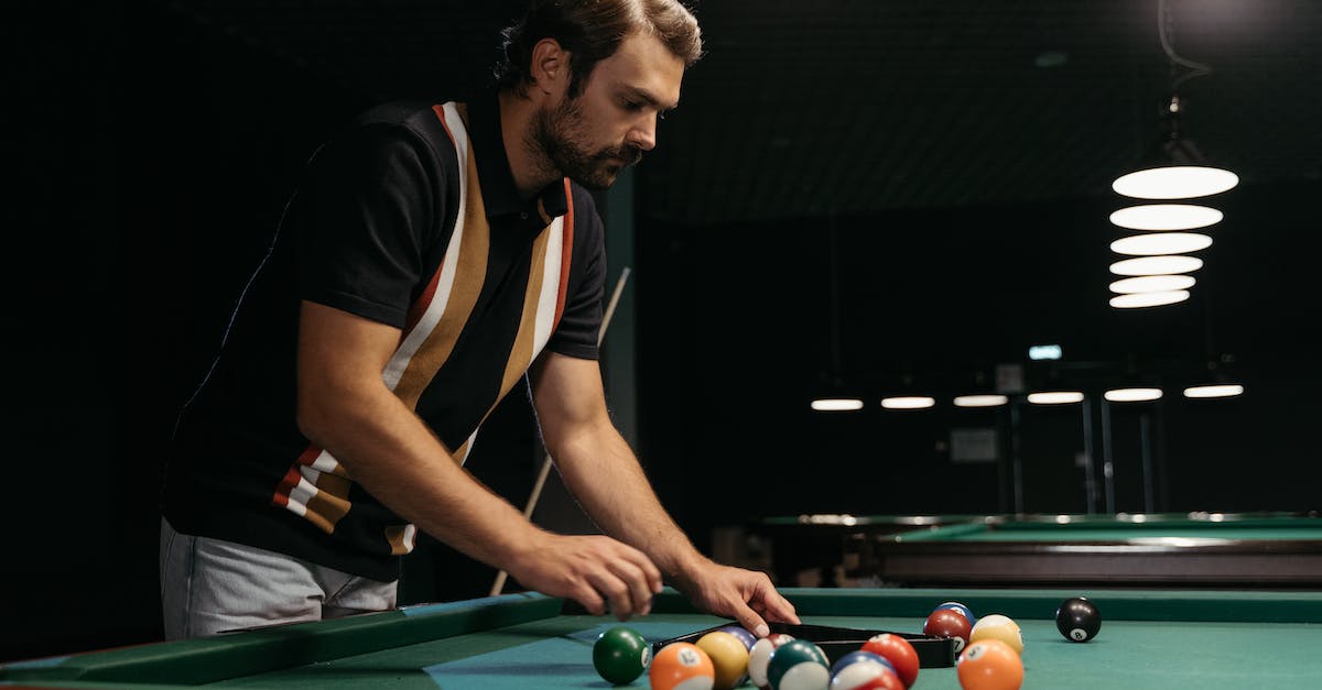 Game corrupted; how can I fix it? - Male Player fixing the Billiard Balls 