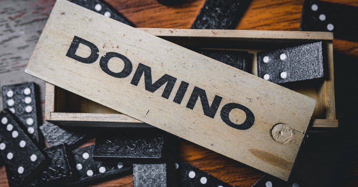 Game Menu Opening Randomly - Set of domino on wooden table Game Menu Opening Randomly - Set of domino on wooden table