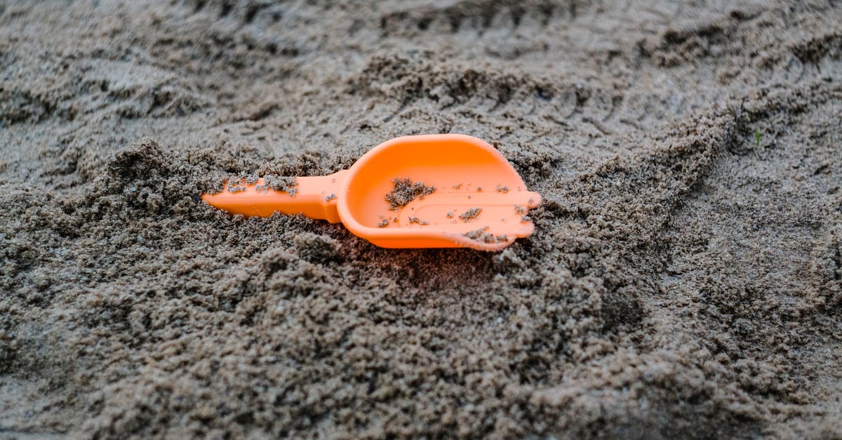 Game Progress Lost after Restoring from Backup? - Colorful sandbox toy on sandy ground